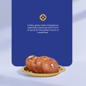 Three badushahs (indian sweet) on a gold plate with a blue background and text describing the sweets